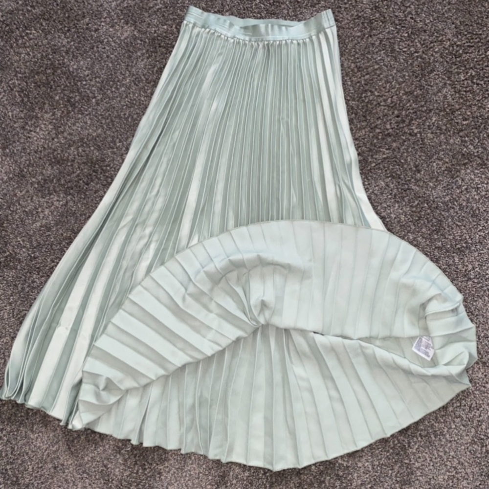H&M silky light green pleated skirt, mid length.